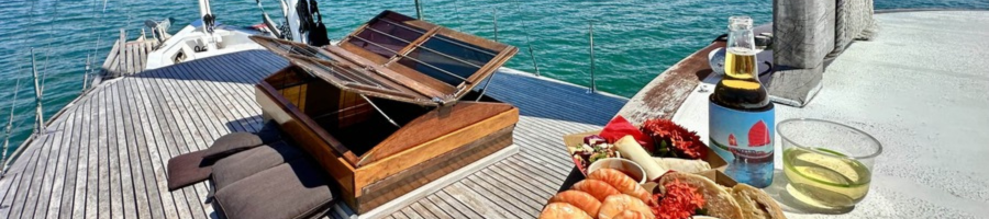 Seafood lunch and drinks on deck of Shaolin Port Douglas Chinese Junk Boat