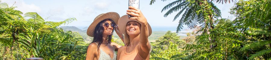 Two women at Alexandra Lookout Two women taking a selfie photo on their phone standing in front of the view at Alexandra Lookout