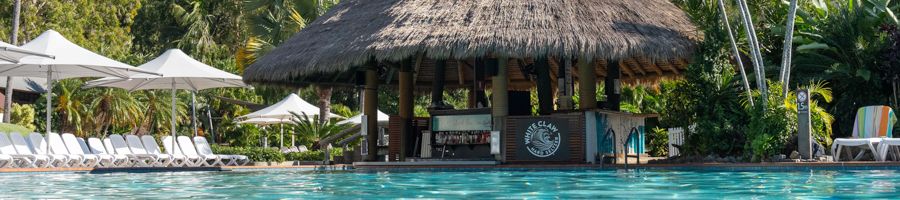 A swim-up bar by swimming pool on an island
