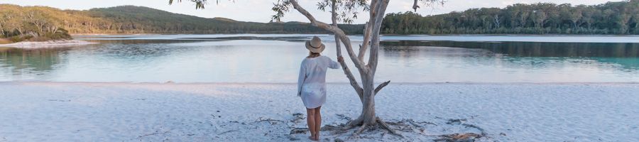 woman standing near tree at Lake McKenzie