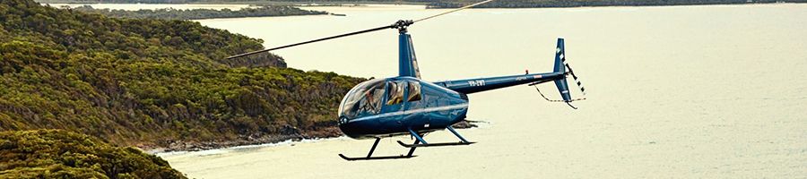 helicopter flying over the sunshine coast
