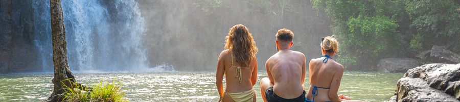 Cedar Creek Falls, Whitsundays A group of three people looking at Cedar Creek Falls