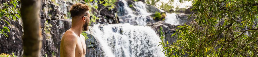 Cedar Creek Falls Whitsundays A man at the Cedar Creek waterfall