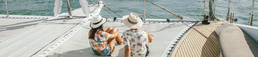 couple sitting on the front deck of passions of paradise