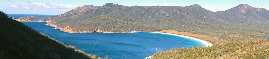 Wineglass Bay, Freycinet, Tasmania Wineglass Bay view with mountains, blue waters and white sands