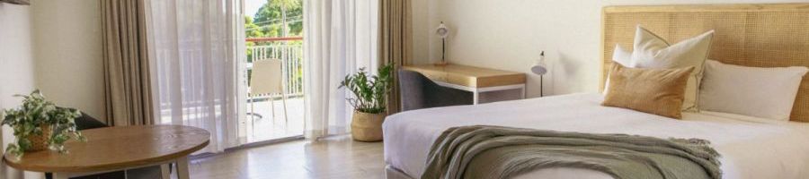 King Room Noosa Heads Motel motel room with balcony and king bed at Noosa Heads Motel