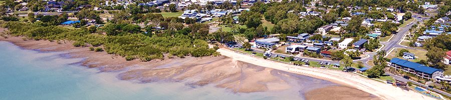 Cannonvale Beach, Airlie Beach Cannonvale Beach at low tide with green trees