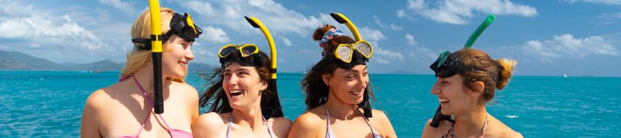 Snorkelling Whitsundays snorkellers smiling with snorkel gear on in the whitsundays