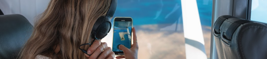 Whitsunday Scenic Flight A girl looking out the window on a plane