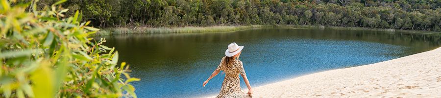 Lake Wabby K'gari traveller walking past lake wabby on kgari sand dunes