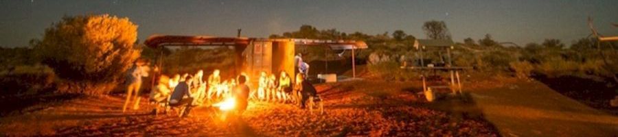 people having a campfire at an outback campsite