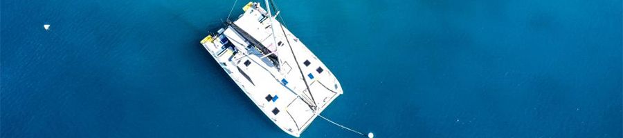 Wings Catamaran aerial view of white catamaran in the whitsundays