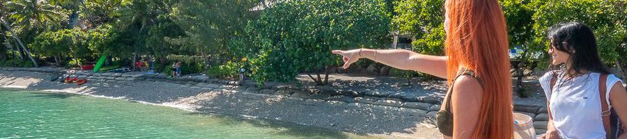 Fitzroy Island girl pointing at the beach on the fitzroy island pier