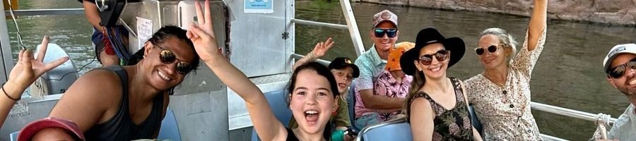 Top End river cruise Families on a river cruise looking for crocodiles