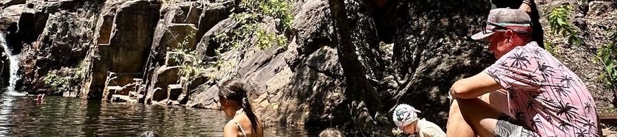 Northern Territory, Australia Families enjoying a natural swimming hole in the Northern Territory