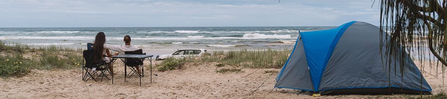 couple camping by the beach on kgari shoreline