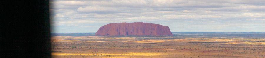 A view of Uluru from the window of a scenic helicopter ride