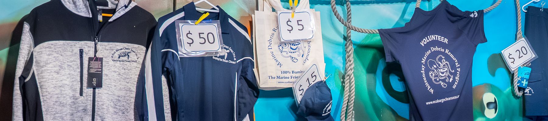 T-shirts and souvenirs in a gift shop at Eco Barge