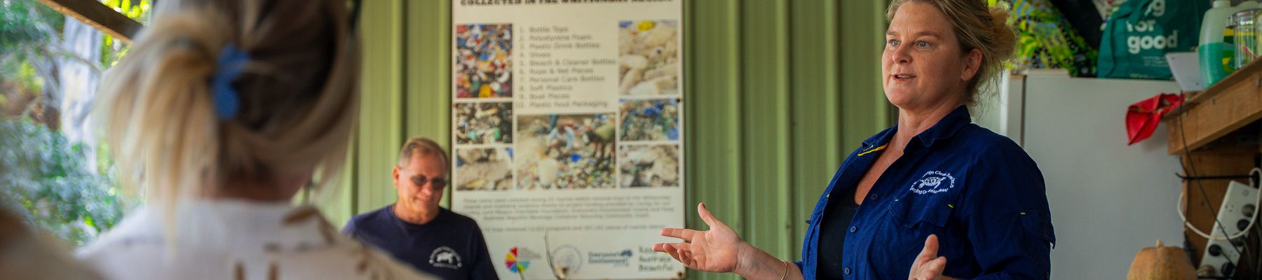 A woman giving a briefing to a group of people 