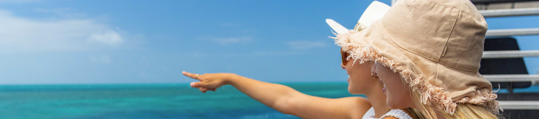 Reefworld Two women pointing out to sea