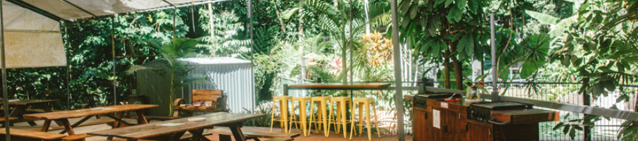 a campground's facilities including chairs and a bbq area