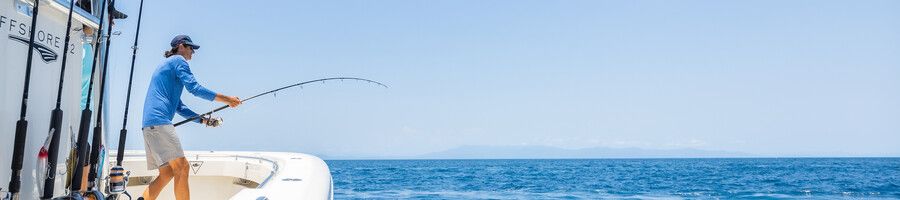 Private fishing charter in the Whitsundays A man fishing on a private charter in the Whitsundays