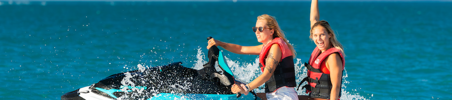 a group of people riding jetskis on a jetski tour