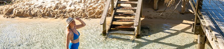 girl walking through Eli Creek on K'gari
