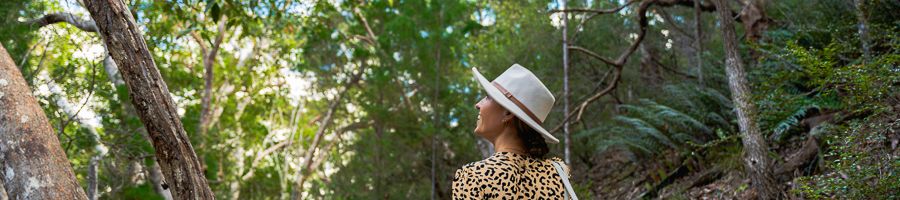 K'gari Rainforest girl walking through the rainforests on kgari