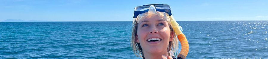 A girl with a snorkel on the Great Barrier Reef