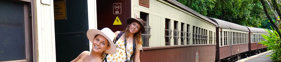 two girls riding the kuranda scenic railway