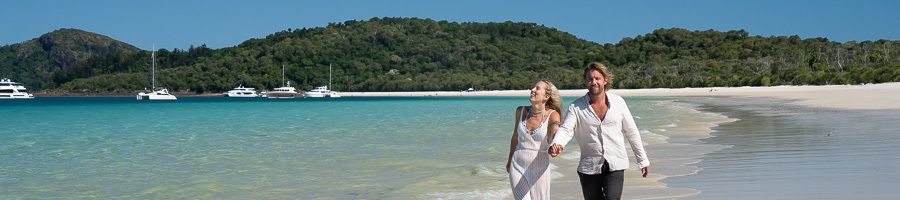 Whitehaven Beach in the Whitsundays A couple walking along Whitehaven Beach