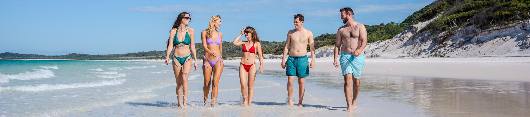A group of friends having fun on a beach 